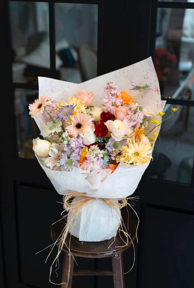 Serene Reverie Woven With Gerbera, Roses And Delicate Cottage Blooms
